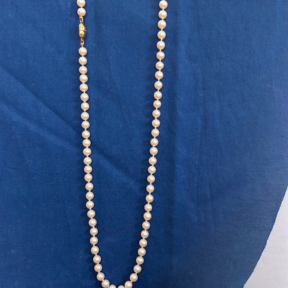 Monet faux pearl single strand necklace. Individually knotted and matching size.